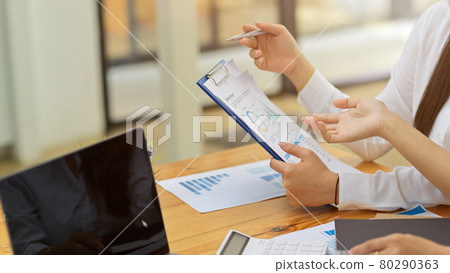 Close up, business lady talking the project result with financial profit report Close up, business lady talking the project result with financial profit report 80290363