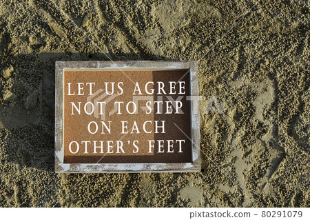 Text on wooden frame laying on sandy beach Text on wooden frame laying on sandy beach 80291079
