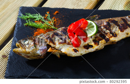 Baked trout with rice, grilled bell pepper Baked trout with rice, grilled bell pepper 80292395