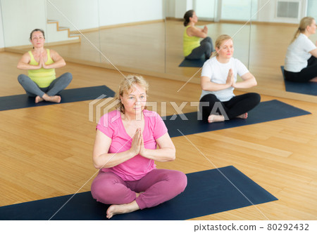 Women are exercising lotus pose Women are exercising lotus pose 80292432