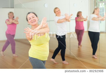Women are dancing in a fitness room 80292986