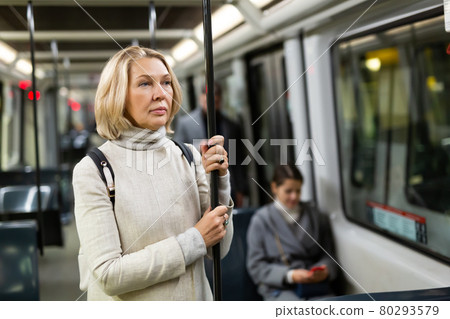 Thoughtful mature woman in streetcar 80293579