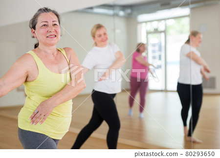 Three women are dancing 80293650