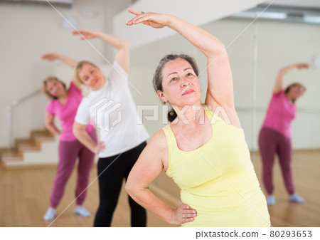 Adult people learning swing steps at dance class Adult people learning swing steps at dance class 80293653