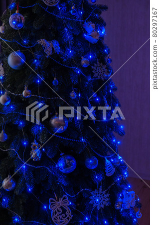Evening winter holiday lights. Blue bokeh lights at night. Christmas tree home interior. Hygge, home sweet home. Evening winter holiday lights. Blue bokeh lights at night. Christmas tree home interior. Hygge, home sweet home. 80297167