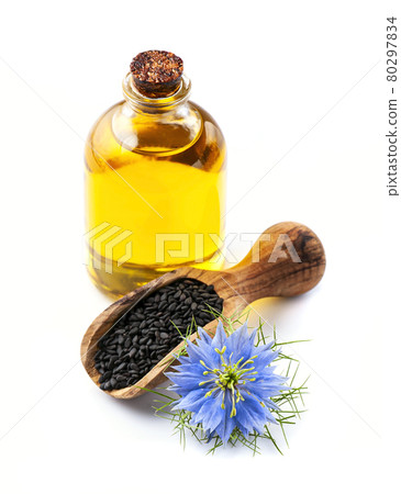 Oil of black cumin on white backgrounds. 80297834