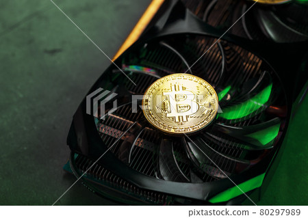 On the powerful fans of the video card there are coins of the Bitcoin cryptocurrency On the powerful fans of the video card there are coins of the Bitcoin cryptocurrency 80297989