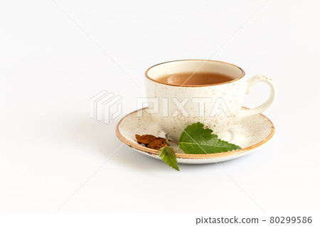 Cup of chaga tea isolated on a white background. Healthy beverage with birch mushroom. Cup of chaga tea isolated on a white background. Healthy beverage with birch mushroom. 80299586