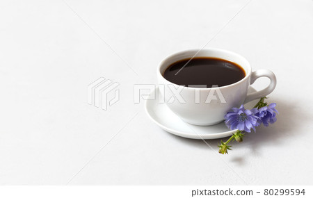 Chicory coffee drink and blue chicory flower on white background. Decaffeinated coffee. Copy space. 80299594