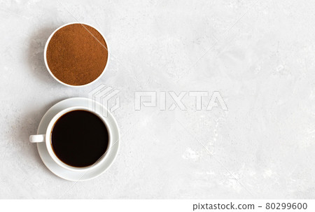 Chicory coffee drink and chicory powder on white background. A small cup of coffee. Decaf. Copy space, view from above. 80299600