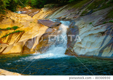 Kagawa Valley where the flow of water continues beautifully on the smooth rock surface made of granodiorite monolith Kagawa Valley where the flow of water continues beautifully on the smooth rock surface made of granodiorite monolith 80300930