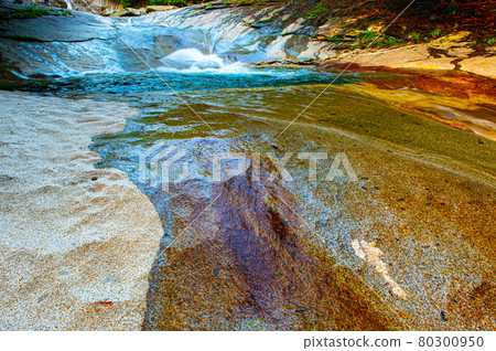 Kagawa Valley where the flow of water continues beautifully on the smooth rock surface made of granodiorite monolith Kagawa Valley where the flow of water continues beautifully on the smooth rock surface made of granodiorite monolith 80300950