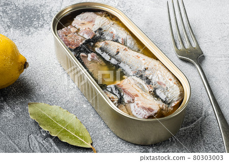 Can of sardines in olive oil, on gray stone table background 80303003