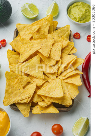 Nachos and guacamole and cheese sauce, on white background 80303366