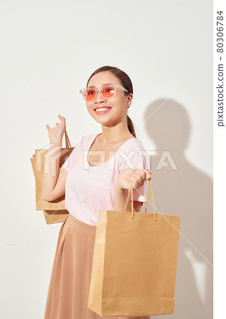 woman cheerful shopping in Holiday at mall 80306784