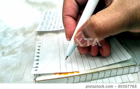 Male hand with pen on empty paper, writing Male hand with pen on empty paper, writing 80307768