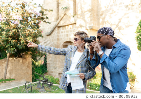 Multicultural african and latin couple enjoing traveling together .middle age mixed race, multi-ethnic couple on vacation in Europe Multicultural african and latin couple enjoing traveling together .middle age mixed race, multi-ethnic couple on vacation in Europe 80309912