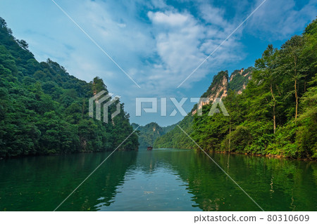 Tourist boat sailing among karst landscape on Baofeng Lake Tourist boat sailing among karst landscape on Baofeng Lake 80310609