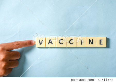 Children hand completing vaccine word on the puzzle 80311378
