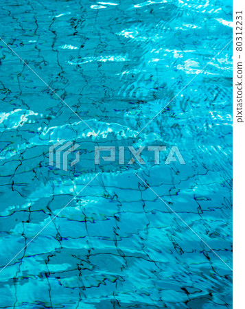 Reflection of sky on the moving water surface in the pool Reflection of sky on the moving water surface in the pool 80312231
