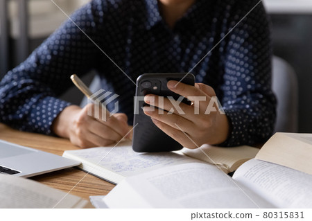 Female student using online learning app on smartphone Female student using online learning app on smartphone 80315831