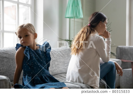 Unhappy mom and daughter sit back to back 80315833