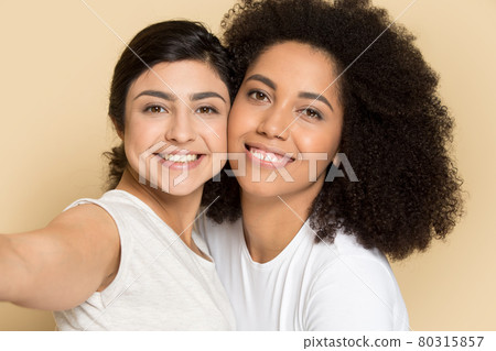 Happy diverse girlfriends make self-portrait picture together Happy diverse girlfriends make self-portrait picture together 80315857