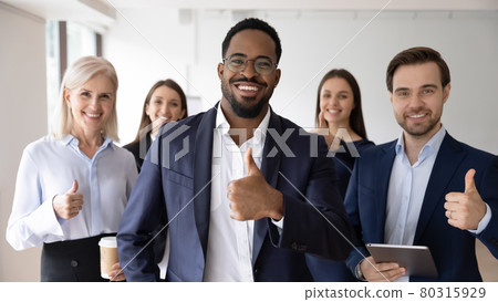 Happy African American business leader and team making thumb up 80315929
