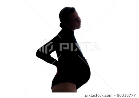 Pregnant woman bends over holding her back in pain. 80316777