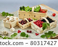 Harvest vegetables in wooden basket on light background 80317427