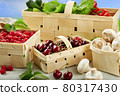 Harvest vegetables in wooden basket on light background 80317430