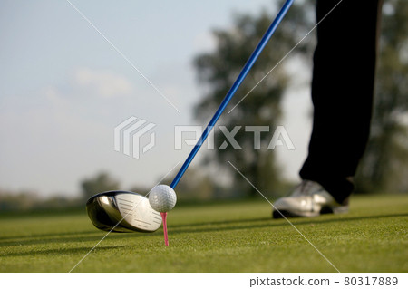Person playing golf, low section 80317889