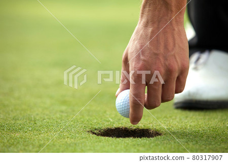 Person holding golf ball, close-up Person holding golf ball, close-up 80317907