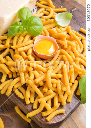 Pasta cooked in chicken broth , fresh pasta. Passatelli in brodo. A pasta formed of eggs, grated Pasta cooked in chicken broth , fresh pasta. Passatelli in brodo. A pasta formed of eggs, grated 80318070