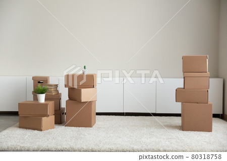 Cardboard boxes in new rental room or house 80318758