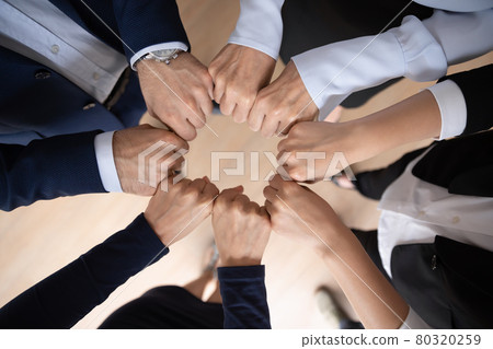 Business team showing expressing strong motivation, engaged in teambuilding activity Business team showing expressing strong motivation, engaged in teambuilding activity 80320259