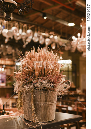 Decor of wheat in a restaurant. Vintage photo with tinted processing. Copy space. 80321017