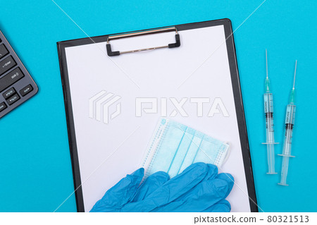 Vaccination or Revaccination Concept - Two Medical Syringe on Blue Table 80321513