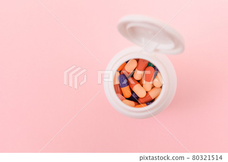 Pharmaceutical Industry and Medicinal Products - Different Colored Pills in Bottle 80321514