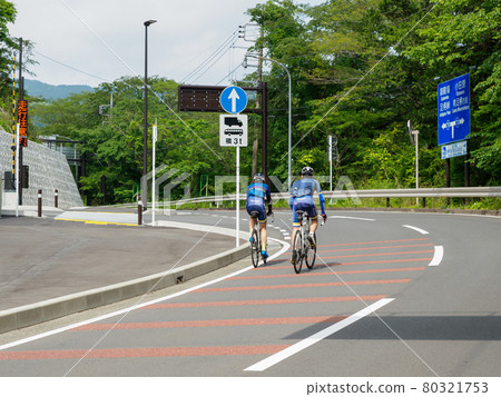 Image of a road bike running on a mountain road 80321753