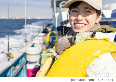 Young woman enjoying sea fishing 80322724