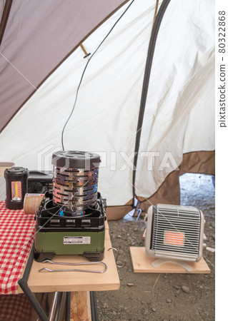 [The inside of the tent is warm with a stove] 80322868