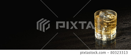 Whiskey poured into a glass 80323313