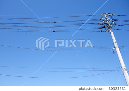 Utility pole transmission line blue sky 80323381