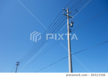 Utility pole transmission line blue sky Utility pole transmission line blue sky 80323386