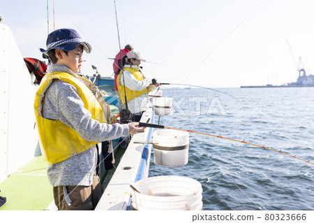 Family enjoying sea fishing 80323666