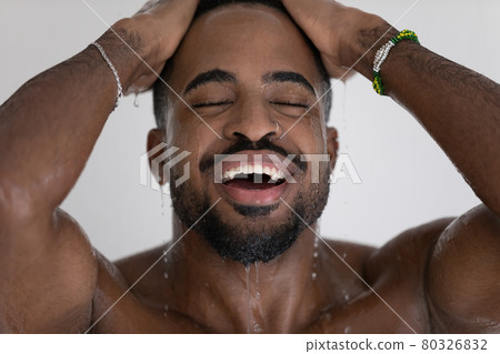Handsome mixed race black man relaxing and taking shower 80326832
