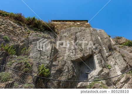 Rockfall Barrier with Wire Mesh on the Cliff - Cinque Terre Liguria Italy Rockfall Barrier with Wire Mesh on the Cliff - Cinque Terre Liguria Italy 80328810
