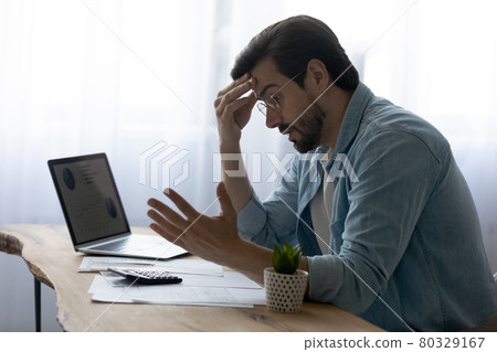 Stressed anxious young man having financial problems. Stressed anxious young man having financial problems. 80329167