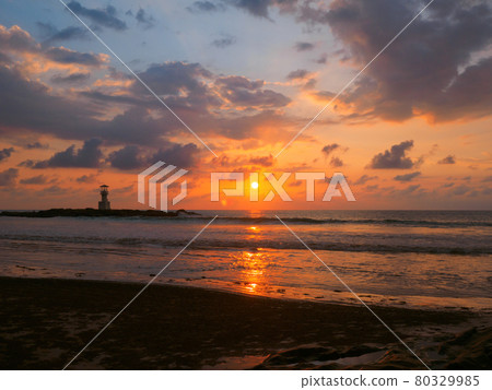 Sunset on a tropical beach with a lighthouse (Kaorak, Phang Nga Province, Kingdom of Thailand) 80329985